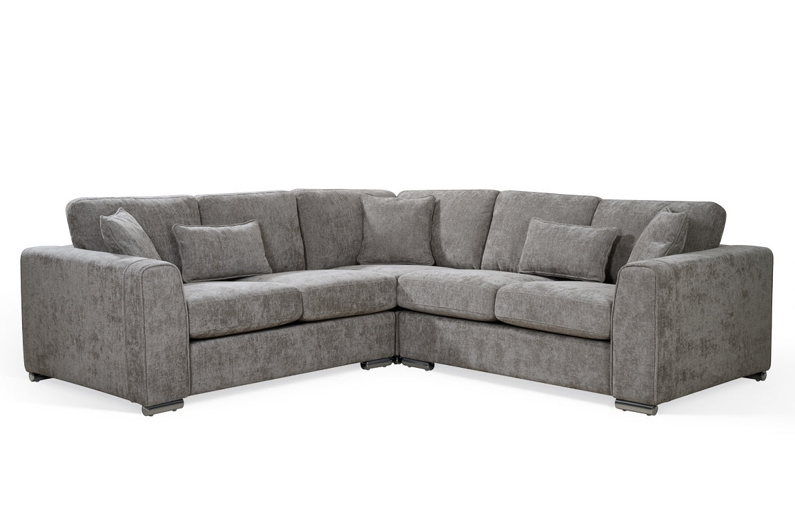grey chenille upholstery corner sofa with fixed cushions and matching bolster cushions and scatter cushions, with silver modern-style legs and wide armrests