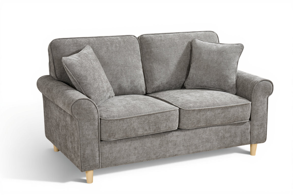 dark grey chenille fabric sofa with two accent cushions on a white background