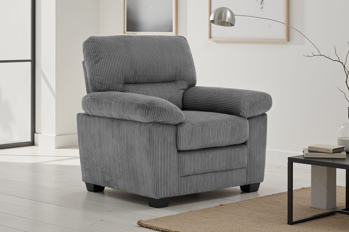 grey jumbo cord 1 seater sofa in a living room