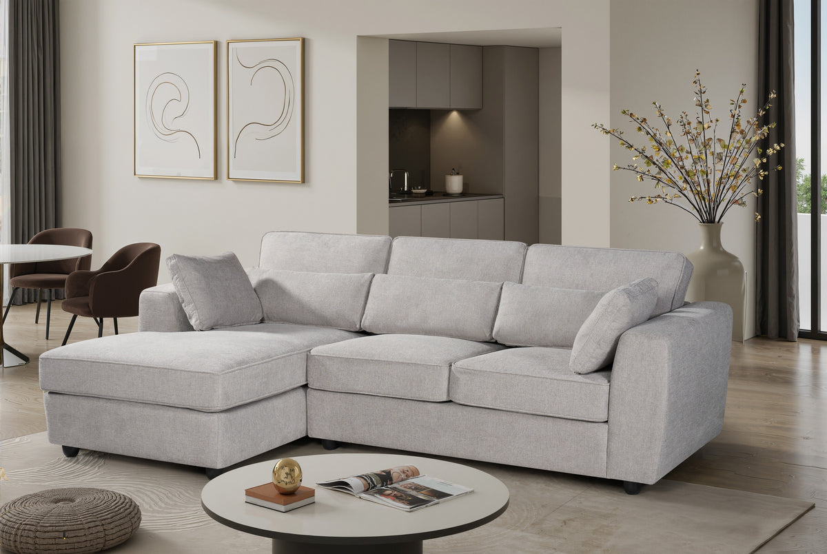 light grey chenille corner sofa with a chaise section, bolster cushions, and accent cushions