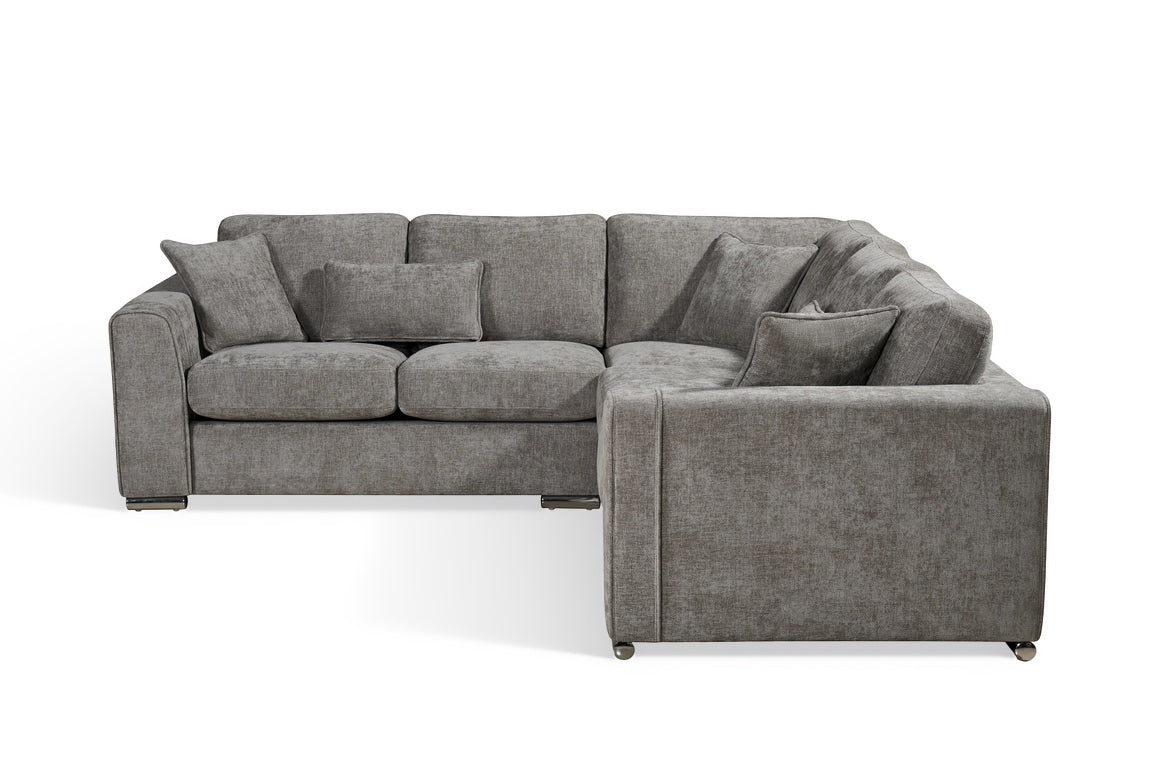 grey chenille upholstery corner sofa with fixed cushions and matching bolster cushions and scatter cushions, with silver modern-style legs and wide armrests