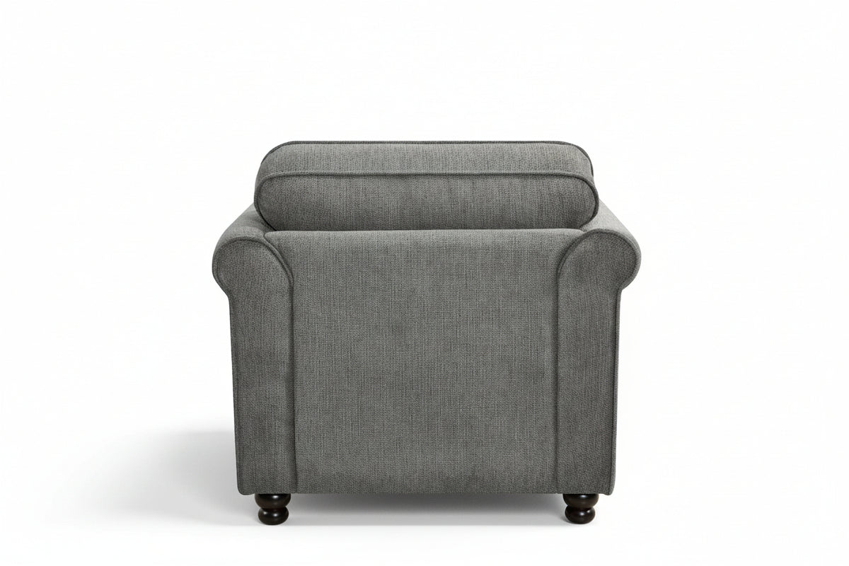 Dark grey chenille 1 seater sofa with an accent cushion and wooden legs on a white background