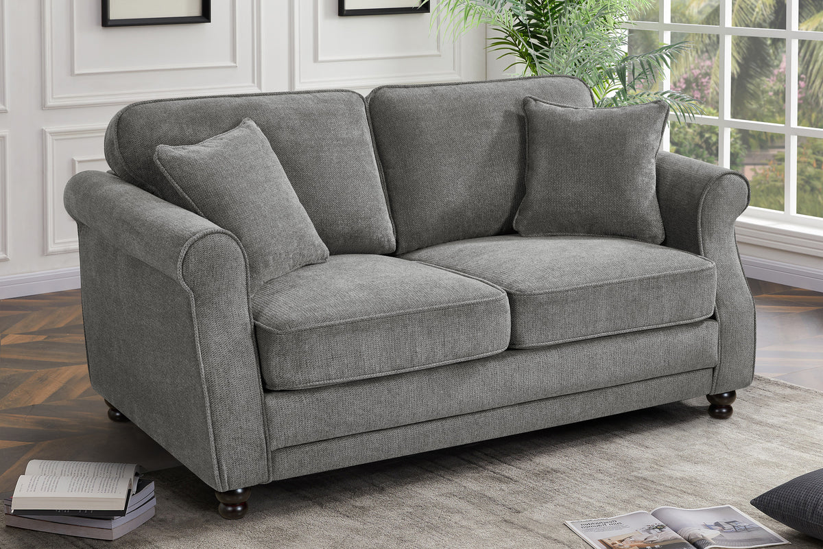 Dark grey chenille 2 seater sofa with accent cushions and wooden legs in a living room.