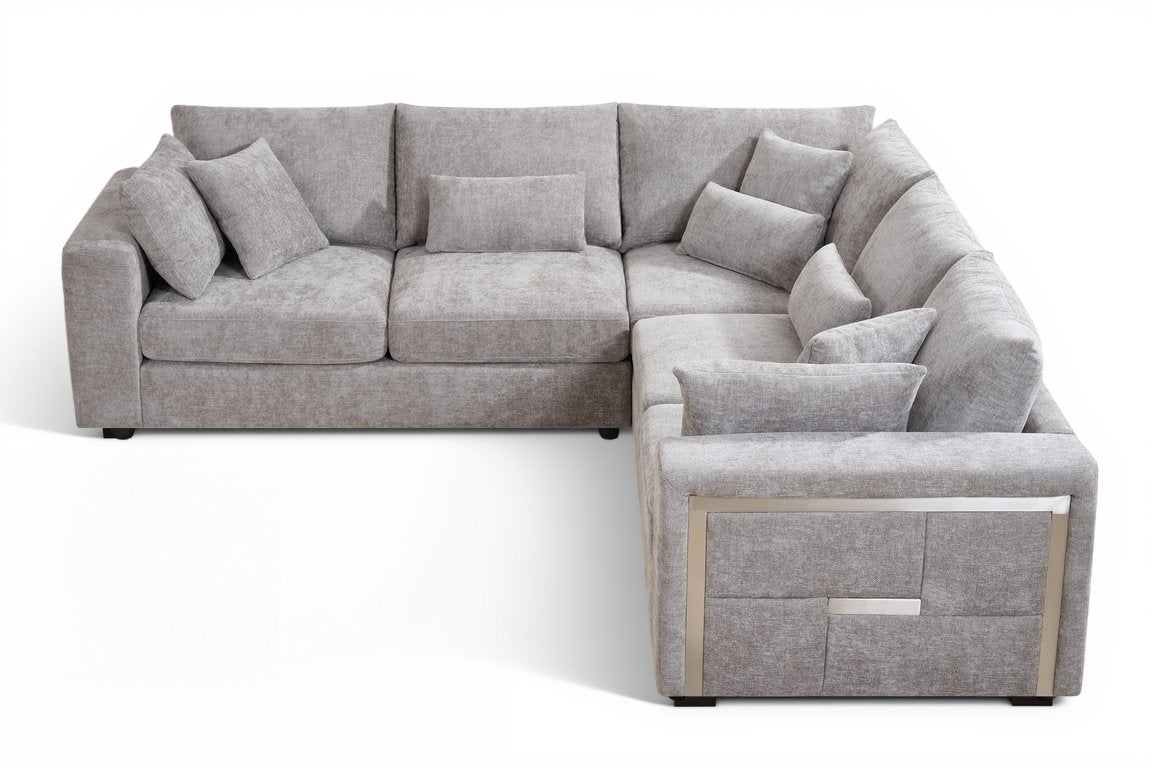 modern grey corner sofa in chenille fabric upholstery with stylish metal trim detail on the sides