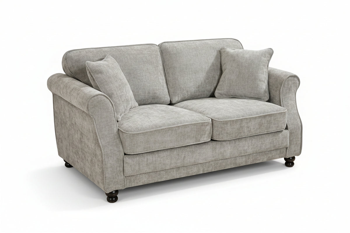 Grey chenille 2 seater sofa with accent cushions and wooden legs on a white background