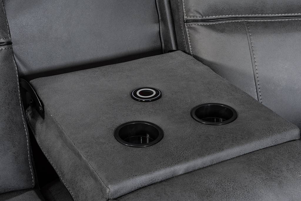 Gray leather corner sofa dropdown console with cup holders.