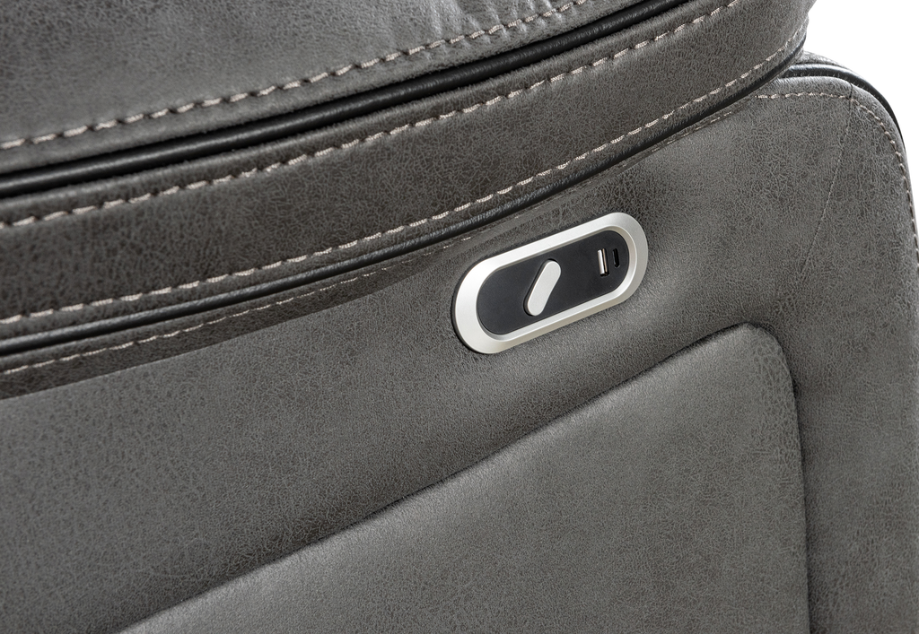 Gray leather corner sofa closeup of the electric recline button.