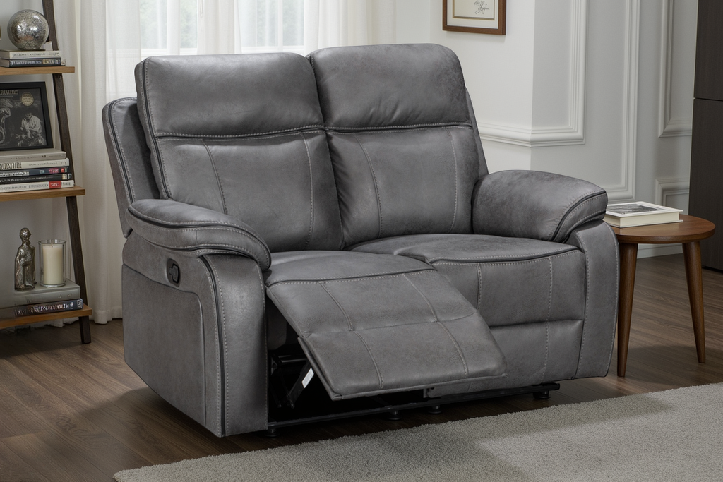 grey 2 seater recliner sofa in a living room setting reclined