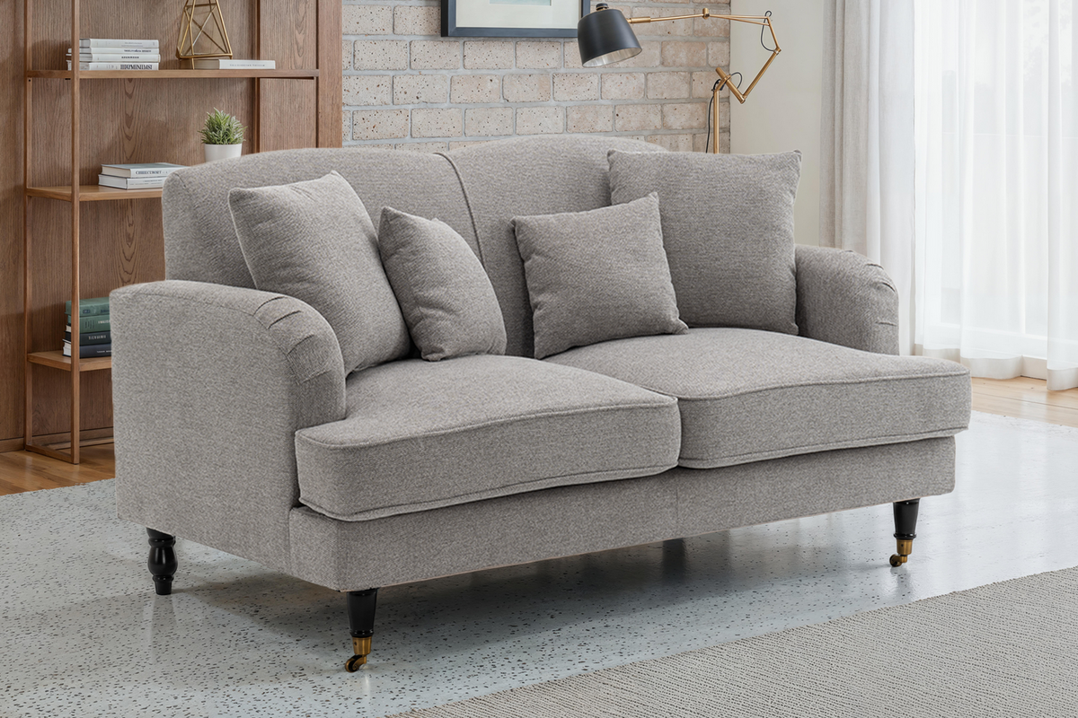 grey 2 seater sofa with cushions in a living room